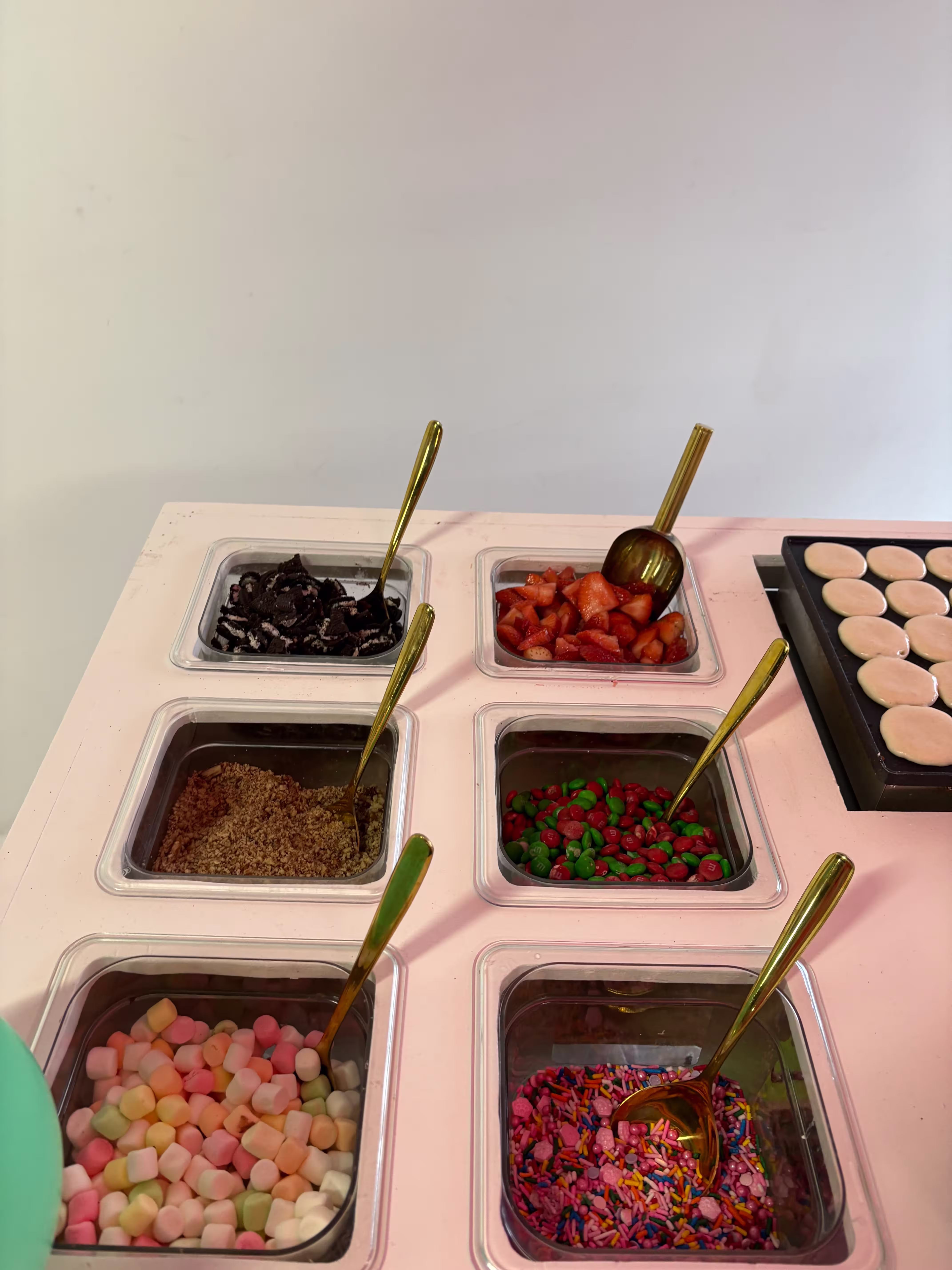 Toppings station with candy and fruits